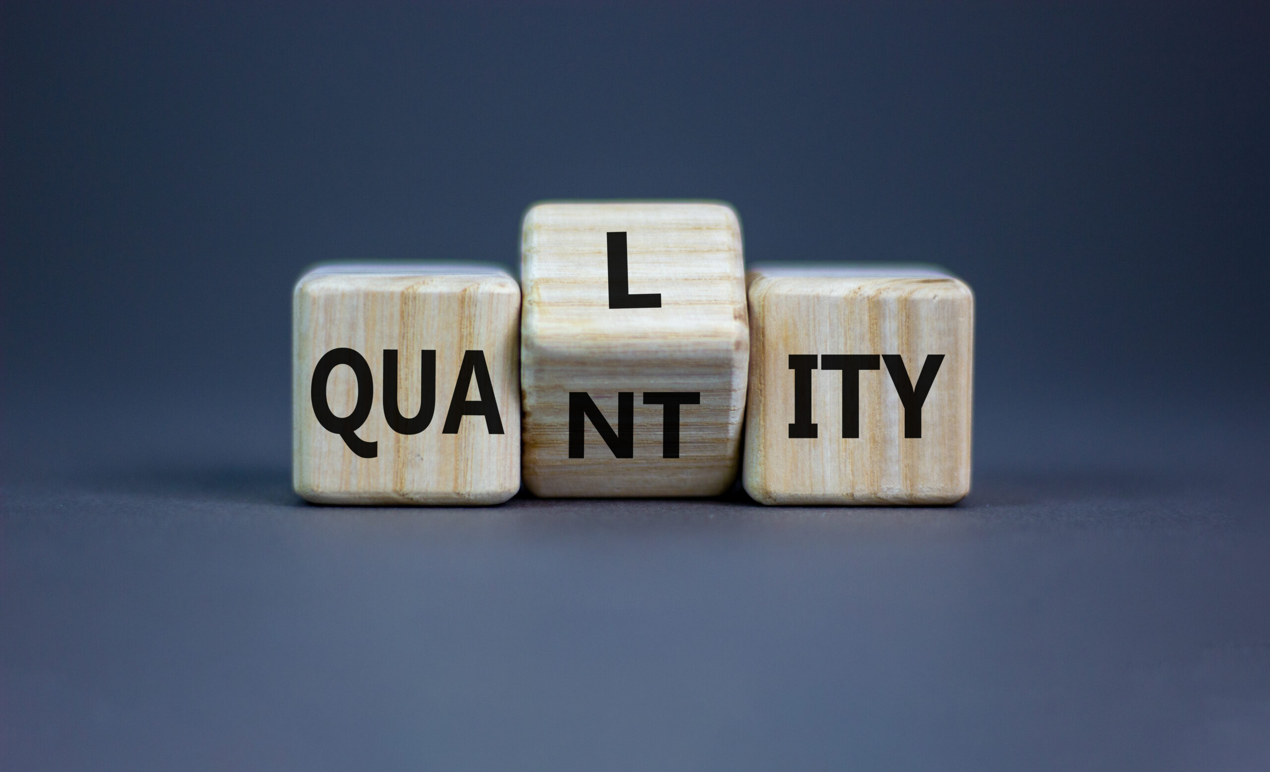 Quality,Over,Quantity,Symbol.,Turned,Cubes,And,Changed,The,Word